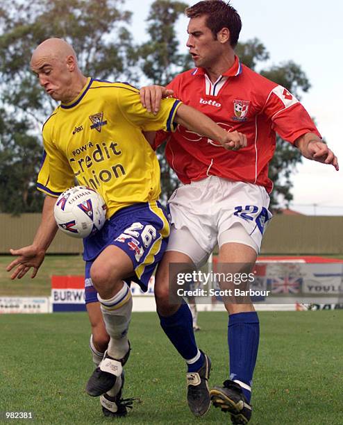 Luke Roddenburg of Parramatta is tackled by Tom Maric of Sydney United during the round 23 NSL match between Sydney United and Parramatta Power...