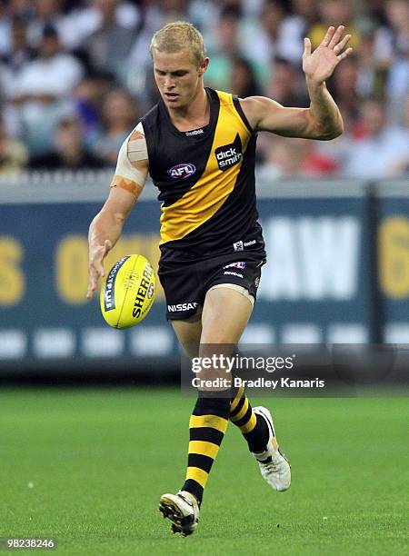 Mitch Farmer of the Tigers kicks the ball during the round two AFL match between the Richmond Tigers and the Western Bulldogs at Melbourne Cricket...