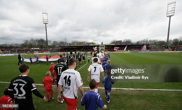 Teams enter the pitch ahead the Second Bundesliga match between Rot-Weiss Oberhausen and 1. FC Kaiserslautern at Niederrhein Stadium on April 4, 2010...