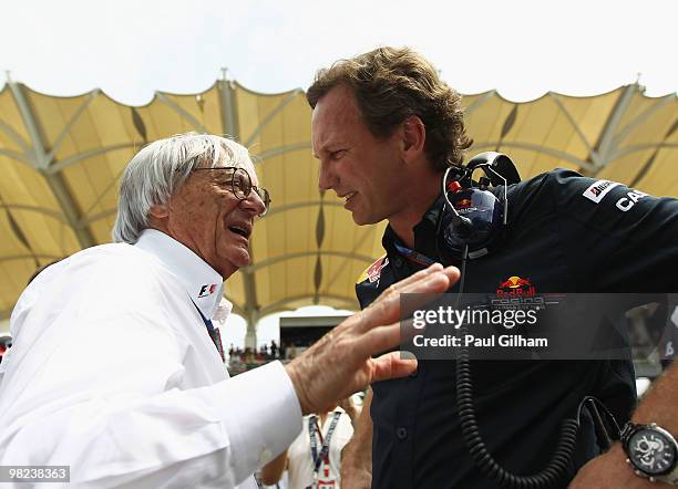 Supremo Bernie Ecclestone talks with Red Bull Racing Team Principal Christian Horner before the Malaysian Formula One Grand Prix at the Sepang...