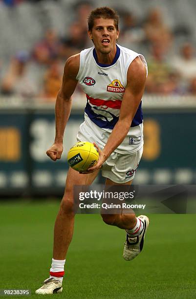 Ryan Hargrave of the Bulldogs handballs during the round two AFL match between the Richmond Tigers and the Western Bulldogs at the Melbourne Cricket...