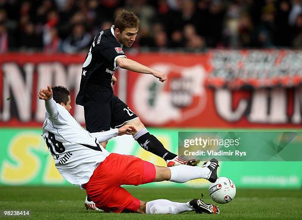 Erik Jendrisek of Kaiserslautern shoots to score his team's first goal as Marinko Miletic of Oberhausen tries to block the shot during the Second...
