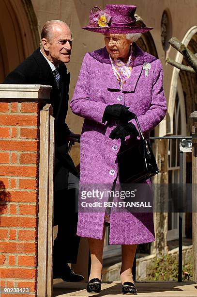 Britain's Queen Elizabeth II and Prince Philip, the Duke of Edinburgh leave after attending an Easter Sunday church service in Windsor on April 4,...