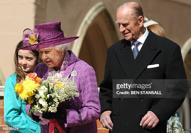 Britain's Queen Elizabeth II and Prince Philip, the Duke of Edinburgh leave after attending an Easter Sunday church service in Windsor on April 4,...