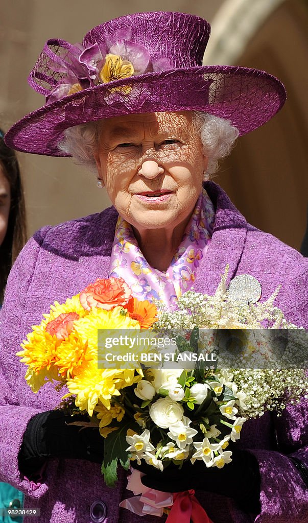 Britain's Queen Elizabeth II holds flowe