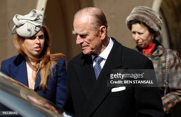 Britain's Prince Philip, the Duke of Edinburgh , Princess Beatrice and Princess Anne leave after attending an Easter Sunday church service in Windsor...