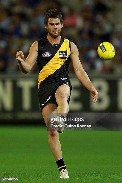 Chris Newman of the Tigers kicks during the round two AFL match between the Richmond Tigers and the Western Bulldogs at the Melbourne Cricket Ground...