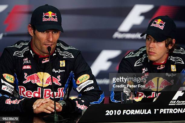 Winner Sebastian Vettel of Germany and Red Bull Racing and second placed Mark Webber of Australia and Red Bull Racing attend the post race press...
