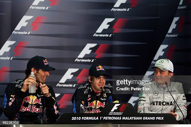 Winner Sebastian Vettel of Germany and Red Bull Racing, second placed Mark Webber of Australia and Red Bull Racing and third placed Nico Rosberg of...