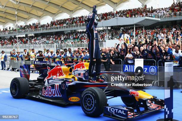 Sebastian Vettel of Germany and Red Bull Racing celebrates in parc ferme after winning the Malaysian Formula One Grand Prix at the Sepang Circuit on...