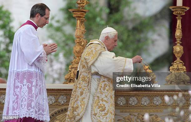 Pope Benedict XVI celebrates Easter Holy Mass in St Peter's Square on April 4, 2010 in Vatican City, Vatican. The ceremony began with Cardinal Angelo...