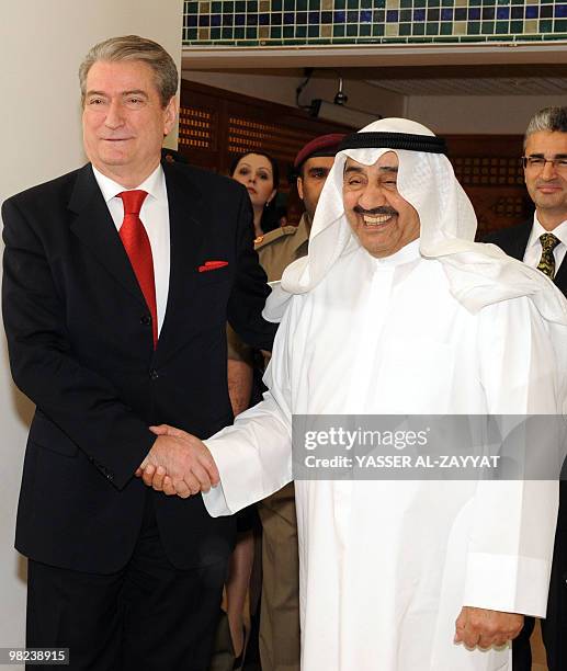 Albanian Prime Minister Sali Berisha shakes hands with Kuwaiti Parliament Speaker Jassem al-Khorafi during a visit to the national assembly building...