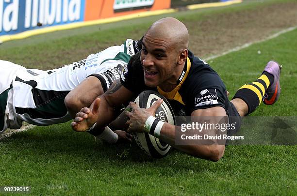 Tom Varndell of Wasps dives over to score a try during the Guinness Premiership match between London Wasps and London Irish at Adams Park on April 4,...