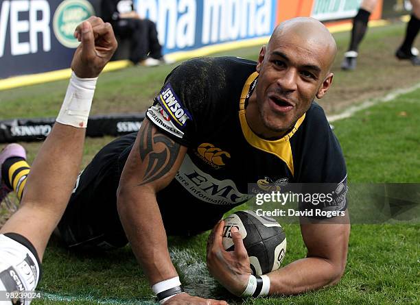 Tom Varndell of Wasps celebrates after diving over to score a try during the Guinness Premiership match between London Wasps and London Irish at...