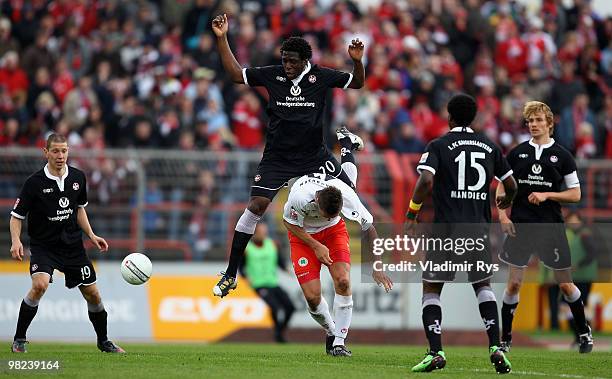 Rodnei of Kaiserslautern jumps on Ronny Koenig of Oberhausen during the Second Bundesliga match between Rot-Weiss Oberhausen and 1. FC Kaiserslautern...