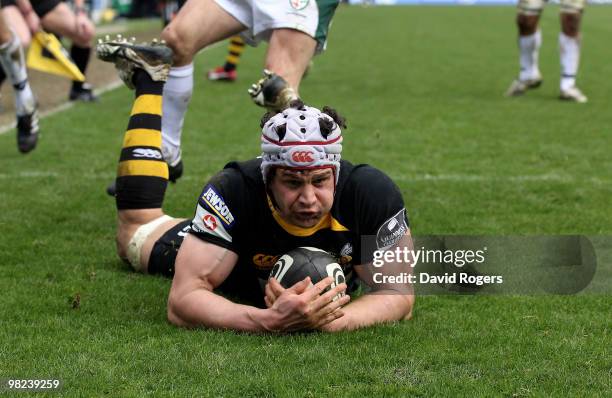 Dan Ward-Smith of Wasps dives over to score a try during the Guinness Premiership match between London Wasps and London Irish at Adams Park on April...