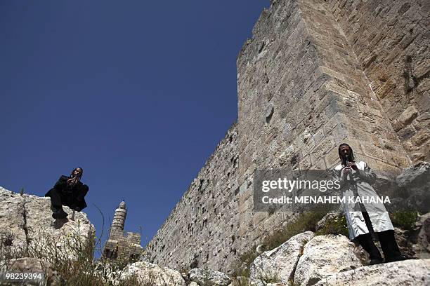 Ultra-Orthodox Jewish Klezemer band members play musical instruments next to the walls of Jerusalem's old city during Passover celebrations on April...