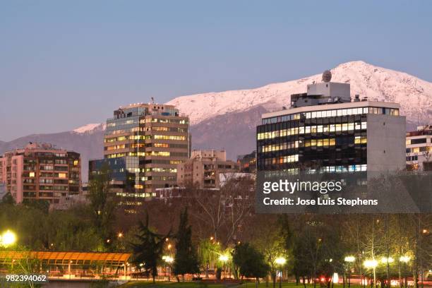 skyline of providencia district with the andes mountain range in the background, santiago de chile - chile skyline stock pictures, royalty-free photos & images
