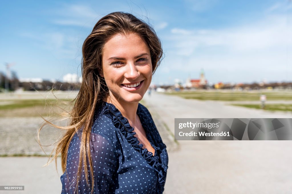 Portrait of beautiful young woman outdoors