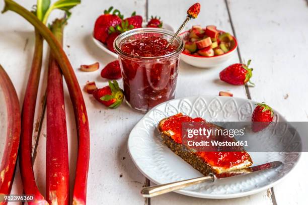breakfast table with strawberry rhubarb marmelade, strawberries and rhubarb - rhubarb imagens e fotografias de stock