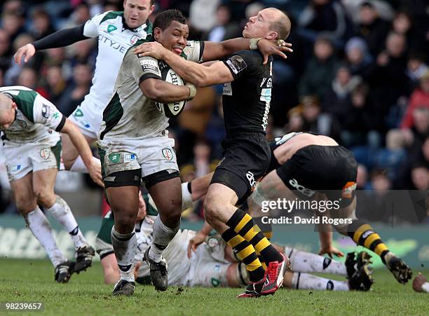 Steffon Armitage of London Irish is tackled by Mark van Gisbergen during the Guinness Premiership match between London Wasps and London Irish at...