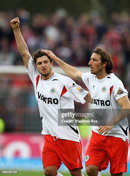 Heinrich Schmidtgal celebrates with his team mate Dimitrios Pappas of Oberhausen after scoring his team's first goal during the Second Bundesliga...