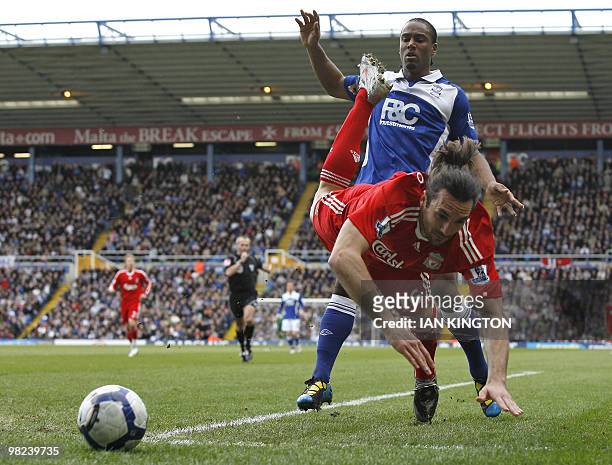 Birmingham City's Cameron Jerome vies with Liverpool's Sotirios Kyrgiakos of Greece during their Premier League match at St Andrew's in Birmingham,...
