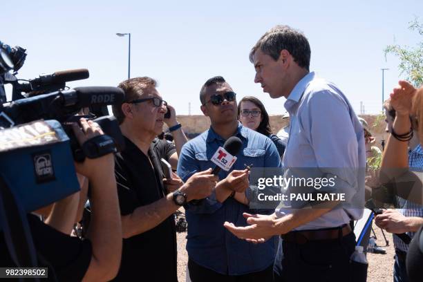 Texas Congressman Beto O'Rourke addresses the press after he and other politicians visited the tent city June 23, 2018 in Tornillo, Texas, housing...