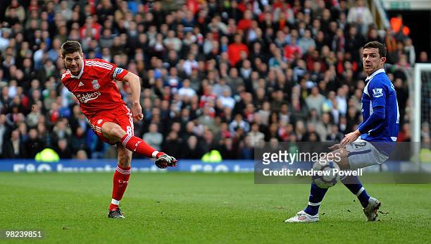 Steven Gerrard of Liverpool plays it past Barry Ferguson of Birmingham during the Barclays Premier League match between Birmingham City and Liverpool...