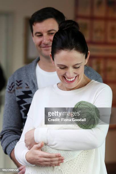New Zealand Prime Minister Jacinda Ardern and partner Clarke Gayford pose for a photo with their new baby girl Neve Te Aroha Ardern Gayford on June...