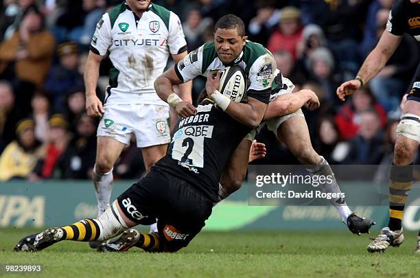 Delon Armitage of London Irish is tackled by Rob Webber during the Guinness Premiership match between London Wasps and London Irish at Adams Park on...