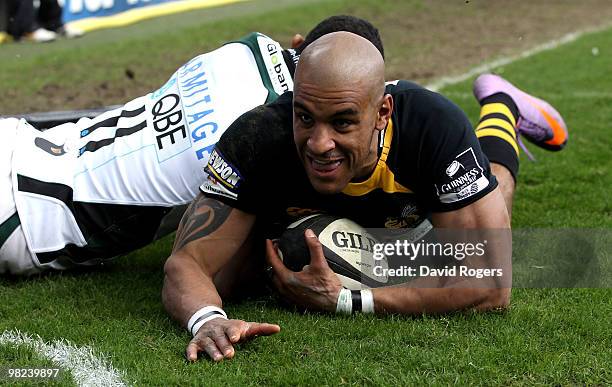 Tom Varndell of Wasps celebrates after diving over to score a try during the Guinness Premiership match between London Wasps and London Irish at...