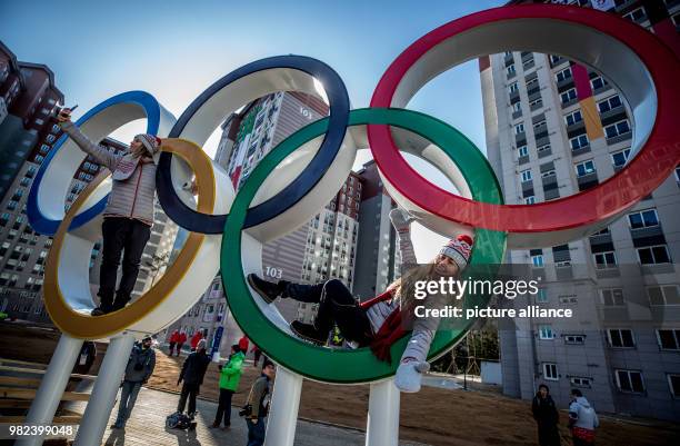 Slovakian snowboarder Chanelle Ruth Sladics lies in the Olympic rings at the Olympic village in Pyeongchang, South Korea, 06 February 2018. Photo:...