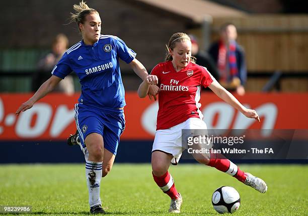 Shelby Hills of Chelsea tries to tackle Kim Little of Arsenal during the Women's FA Cup Semi Final match between Chelsea and Arsenal at Wheatsheaf...