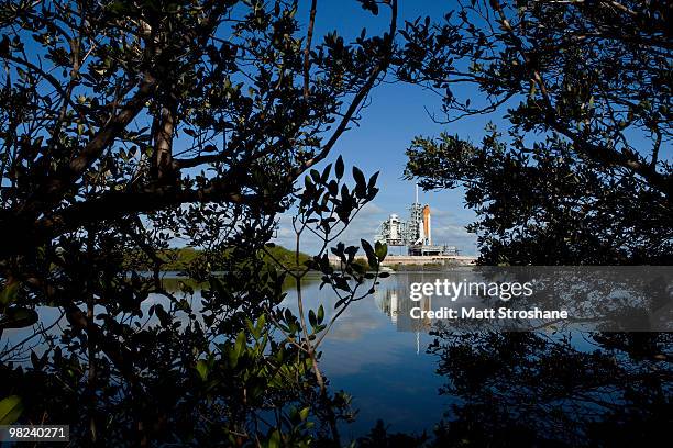 Space Shuttle Discovery sits on launch pad 39-A as the rotating service structure rolls back at Kennedy Space Center on April 4 in Cape Canaveral,...