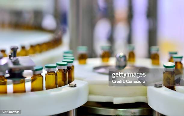 reagents bottle at annulus production line - chemical products stock-fotos und bilder