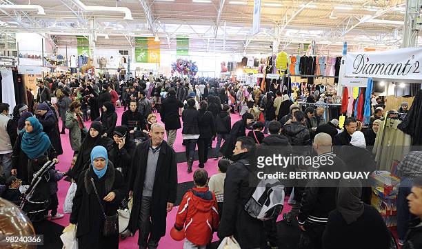 People attend the annual meeting of French Muslims organized by the Union of Islamic Organisations of France in Le Bourget, outside Paris, on April...