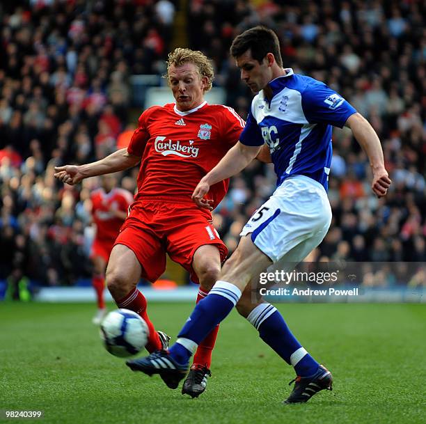 Dirk Kuyt of Liverpool competes with Scott Dann of Birmingham during the Barclays Premier League match between Birmingham City and Liverpool at St....