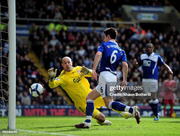 Liam Ridgewell of Birmingham City scores past Liverpool goalkeeper Pepe Reina during the Barclays Premier League match between Birmingham City and...