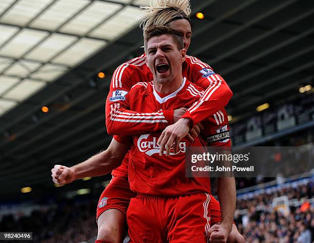 Steven Gerrard of Liverpool celebrates after scoring a goal with Fernando Torres during the Barclays Premier League match between Birmingham City and...