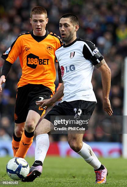 Clint Dempsey of Fulham is closed down by James McCarthy of Wigan Athletic during the Barclays Premier League match between Fulham and Wigan Athletic...