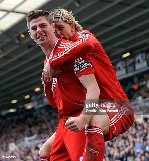 Steven Gerrard of Liverpool celebrates after scoring a goal with Fernando Torres during the Barclays Premier League match between Birmingham City and...