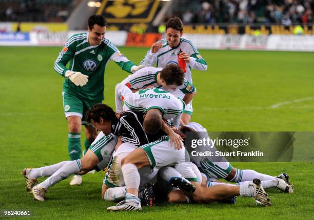 Players of Wolfsburg celebrate at the end of the Bundesliga match between VfL Wolfsburg and 1899 Hoffenheim at Volkswagen Arena on April 4, 2010 in...