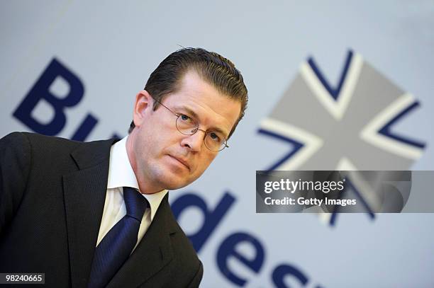 German Defense Minister Karl-Theodor zu Guttenberg looks on during a press conference about the latest gun battle between Bundeswehr soldiers and...