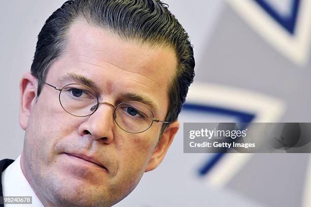 German Defense Minister Karl-Theodor zu Guttenberg looks on during a press conference about the latest gun battle between Bundeswehr soldiers and...