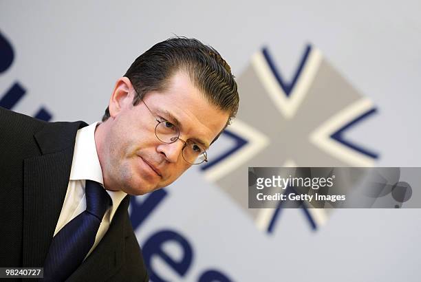 German Defense Minister Karl-Theodor zu Guttenberg looks on during a press conference about the latest gun battle between Bundeswehr soldiers and...
