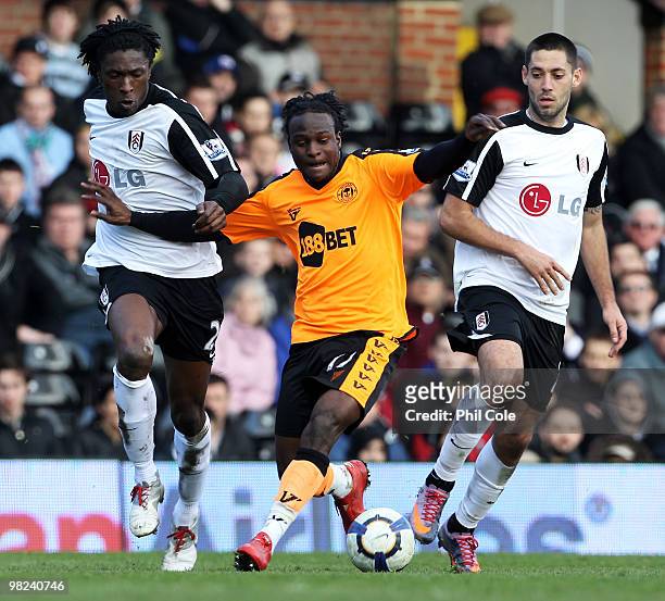 Victor Moses of Wigan Athletic takes on Dickson Etuhu and Clint Dempsey of Fulham during the Barclays Premier League match between Fulham and Wigan...