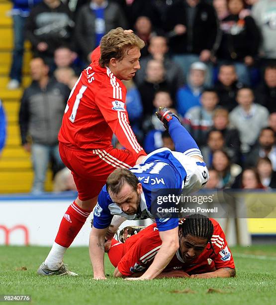 Lucas Levia and Glen Johnson both of Liverpool compete with James McFadden of Birmingham during the Barclays Premier League match between Birmingham...