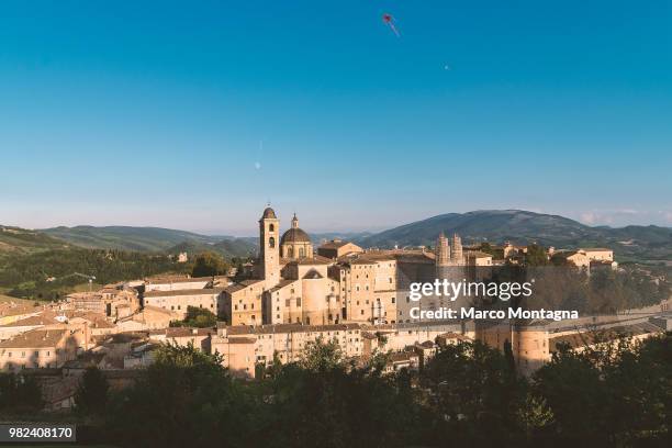 the ideal city, the moon, a kite - montagna stock pictures, royalty-free photos & images