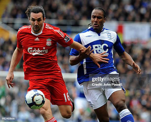 Sotirios Kyrgiakos of Liverpool competes with Cameron Jerome of Birmingham during the Barclays Premier League match between Birmingham City and...